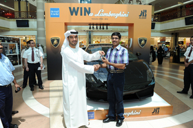 Soopy-Abdulla-winning-new-Lamborghini-Gallardoi-prize.jpg